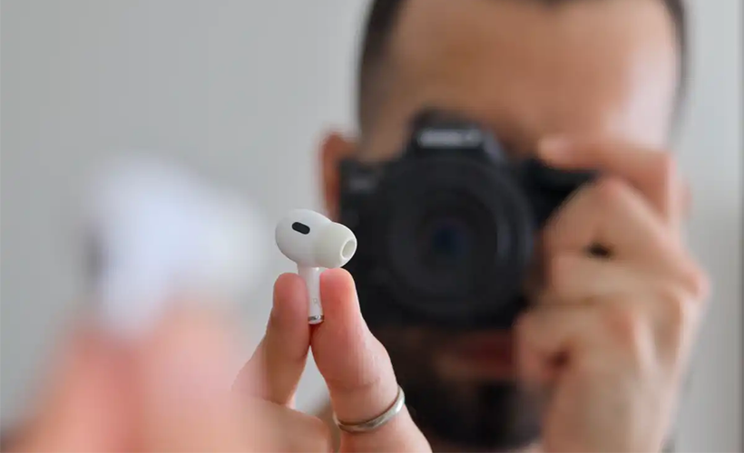 A new gesture-based control lets you press and hold the stem of your AirPods to snap a photo or start a video recording.